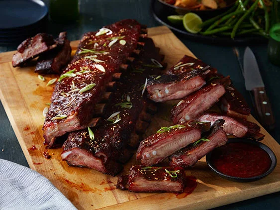 Gochujang Glazed St. Louis-Style Ribs Recipe on a cutting board