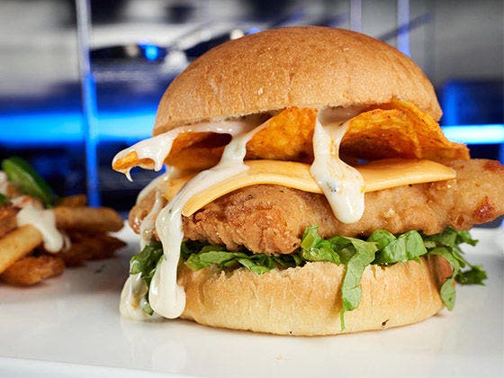 crispy sandwich with nacho chips within the sandwich