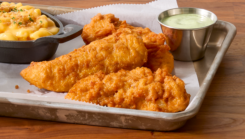 Image of Tyson® Honey Stung® Fully Cooked Lightly Breaded Hot Honey Chicken Breast Chunks in restaurant setting