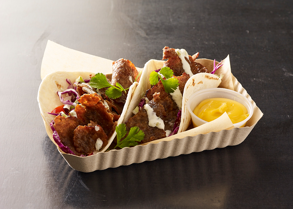 sliced beef tacos with sauce