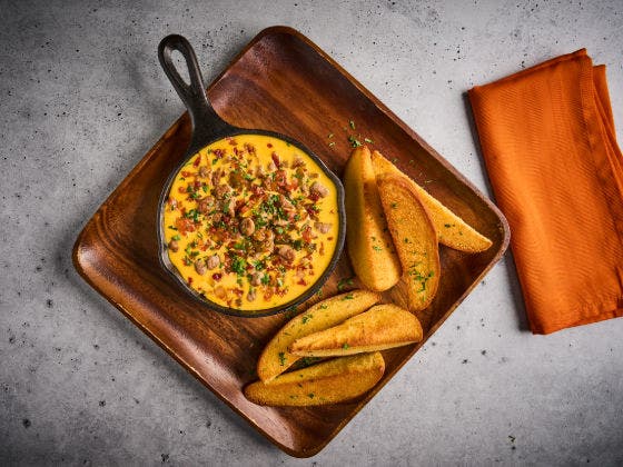 Cheeseburger Quest In a Skillet on a Board