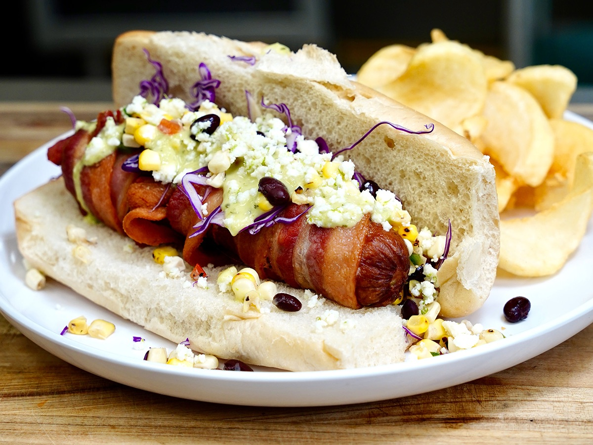 Bacon wrapped jalapeno link in a hot dog bun