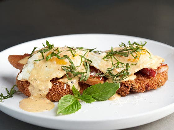 Arancini Cake with garnish on a plate.