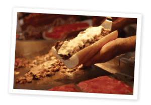 Philly Steak Sandwich being topped with cheese