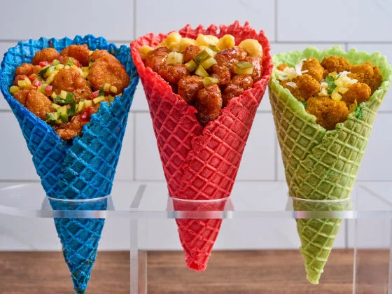 Image of Crispy Chicken and Waffle Cone Flight with blue, pink, and green waffle cones.